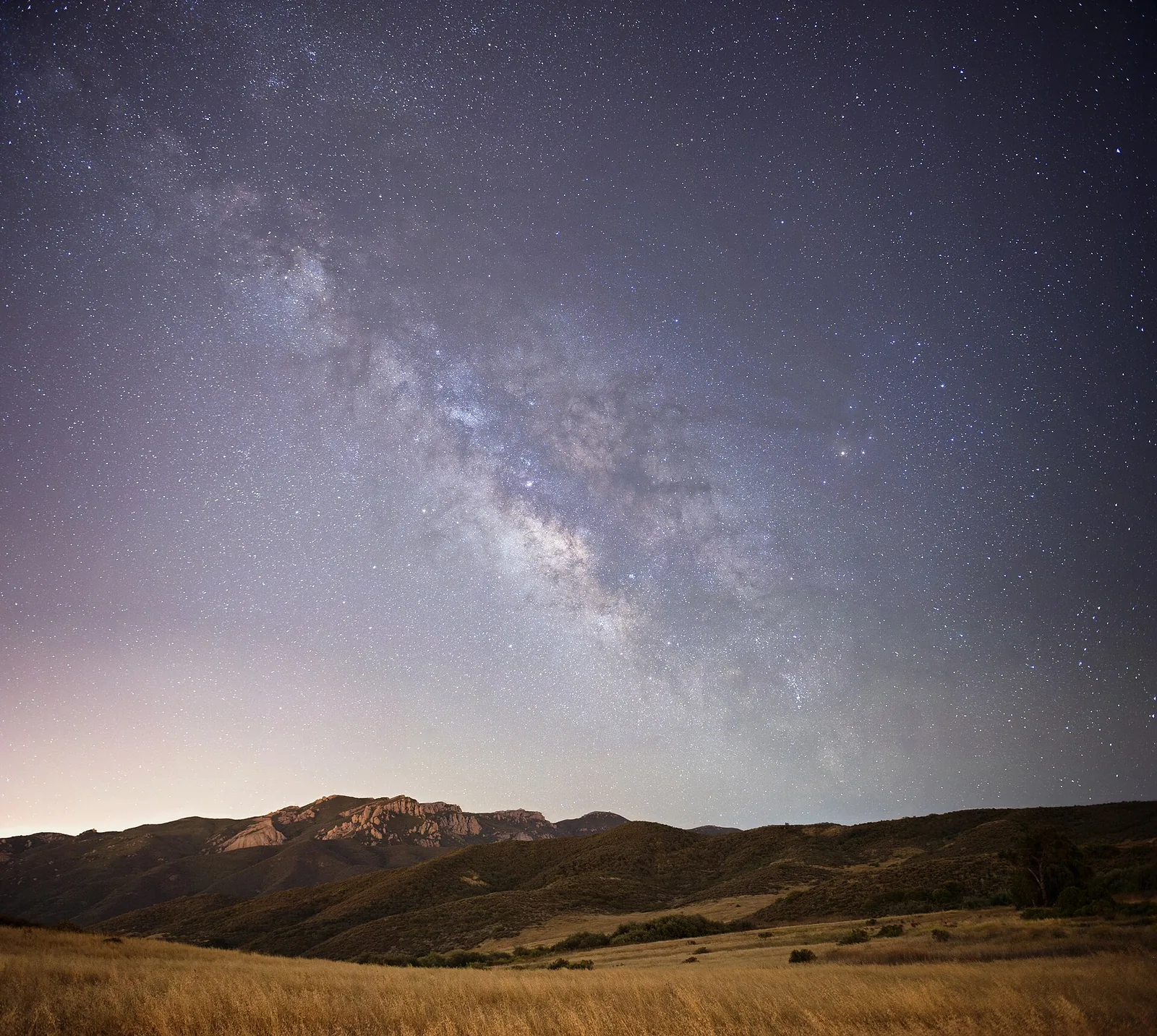 The Milky Way over the mountain ridge