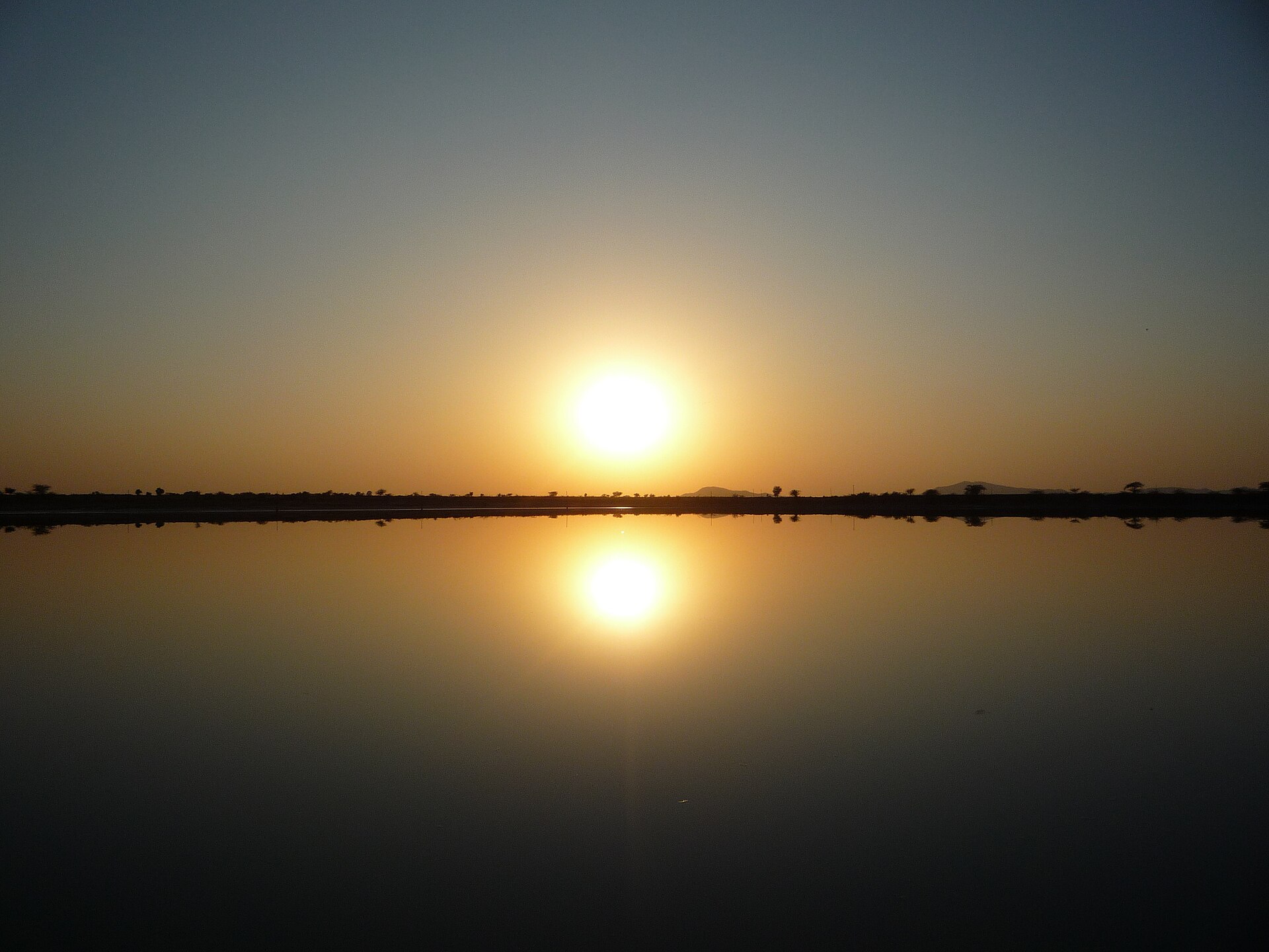 The salt flats of Sambhar Lake, Rajasthan, under a wide open sky
